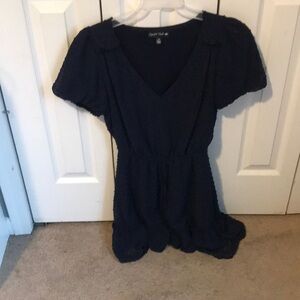 Navy peblem dress with textured dots on it by crystal doll